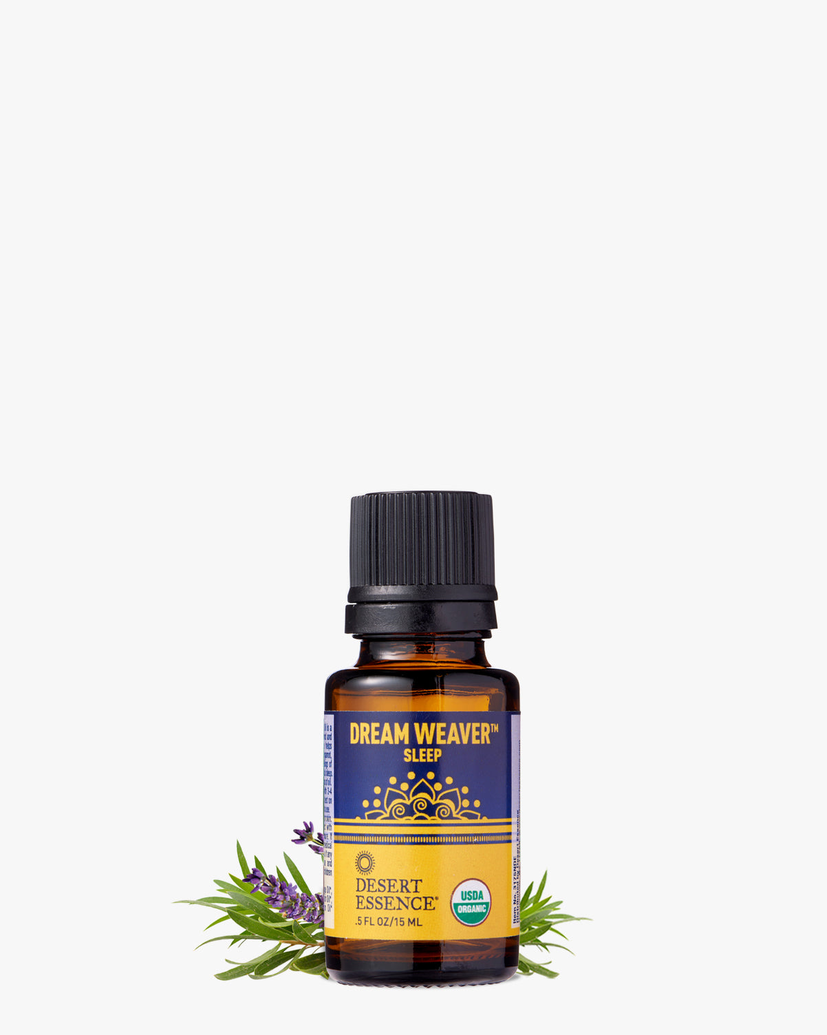 Dream Weaver Organic Essential Oil blend in amber glass bottle with black cap, featuring blue and gold label design, displayed with fresh lavender sprigs and green leaves against white background, highlighting its natural sleep-promoting ingredients.