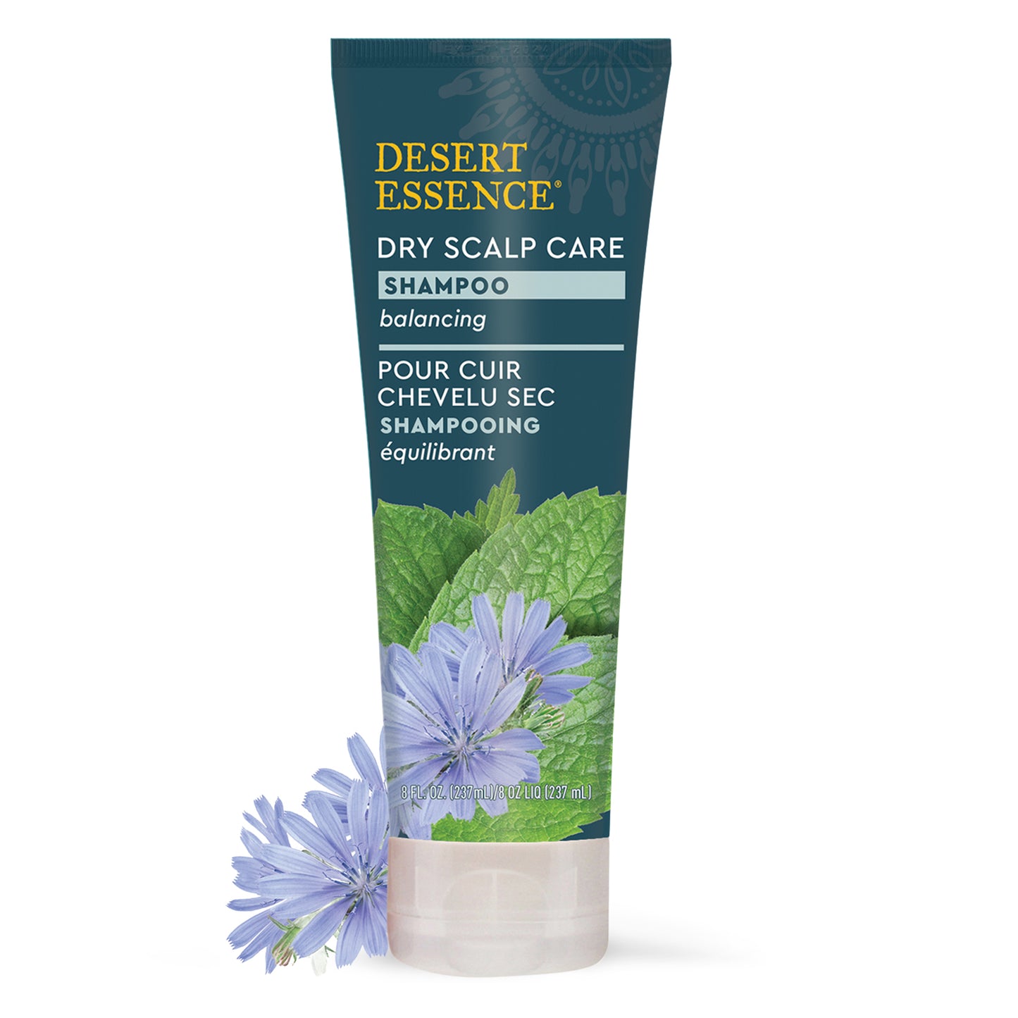 front of grey dry scalp care shampoo bottle with green leaf and purple flower on bottle. purple flower sitting next to shampoo bottle