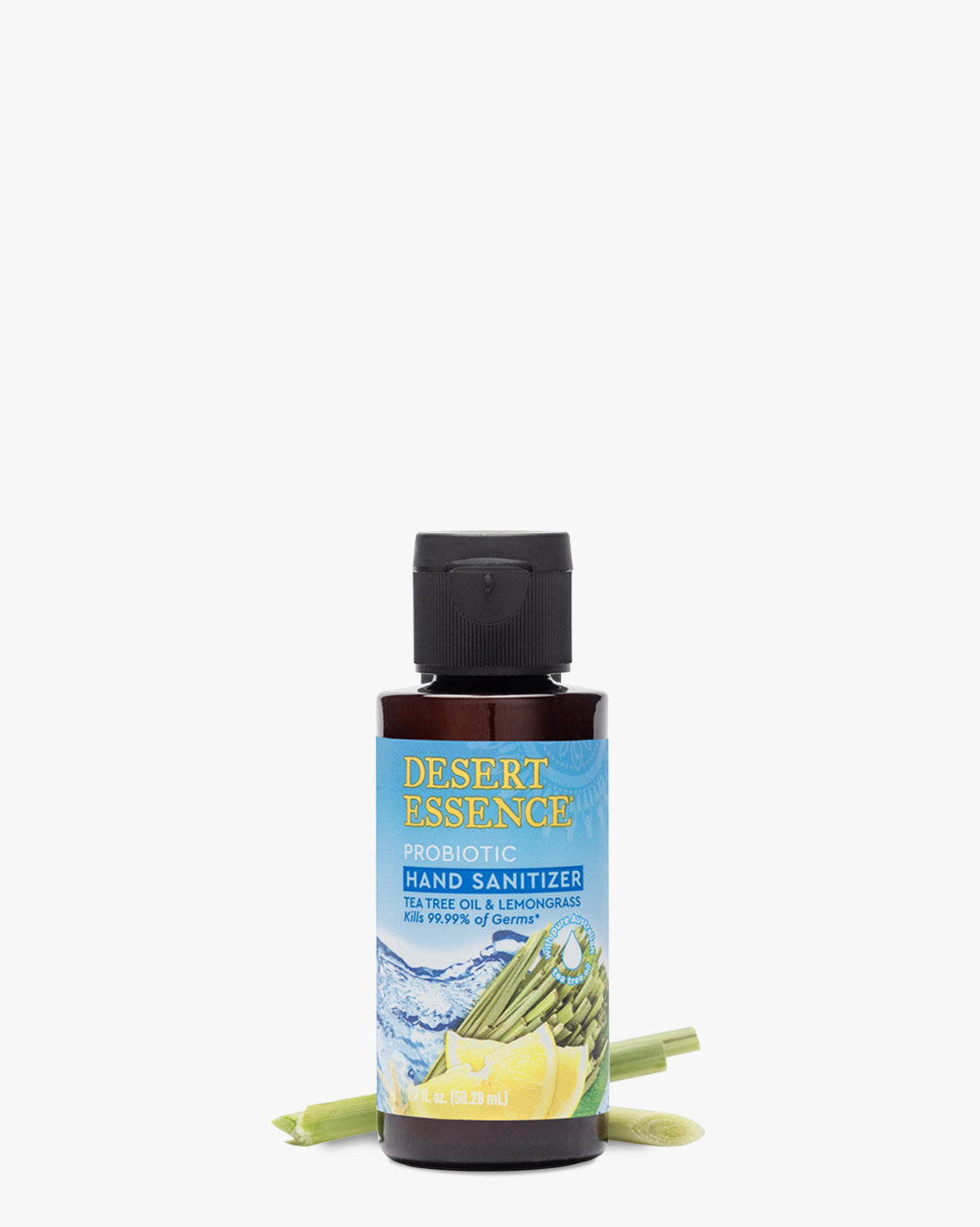 Tea Tree Oil & Lemongrass Probiotic Hand Sanitizer 1.7oz bottle by Desert Essence, featuring a blue and yellow label design, displayed with fresh lemongrass stalks against a white background. The clear plastic bottle contains a dark-colored sanitizing formula.
