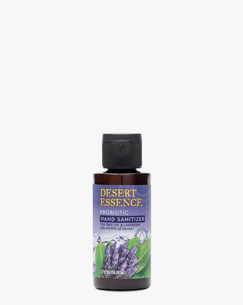 Desert Essence Tea Tree Oil & Lavender Probiotic Hand Sanitizer 1.7oz in a dark amber bottle with purple label featuring lavender plant illustration. Natural probiotic sanitizer combining tea tree and lavender essential oils for effective germ protection.