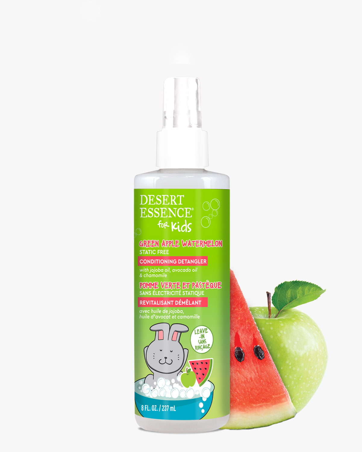 Green Apple Watermelon Conditioning Detangler Spray for Kids by Desert Essence, shown with fresh watermelon slice and green apple. White spray bottle with bright green label featuring cartoon bunny artwork and fruit illustrations, 8 fl oz size.