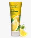 8 fl. oz. tube of the Lemon Tea Tree Clarifying Shampoo next to lemon wedges  by Desert Essence.