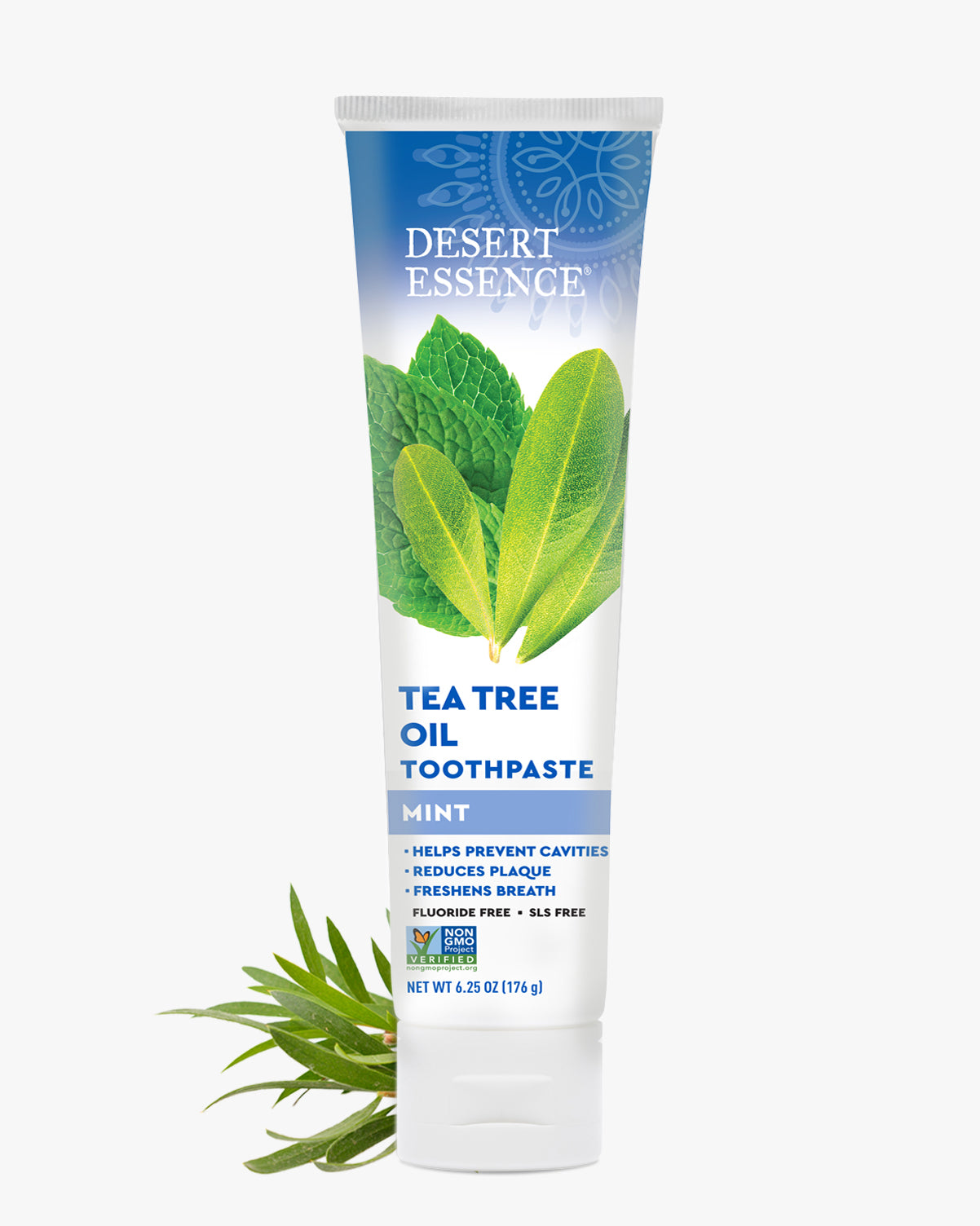 Desert Essence Tea Tree Oil Toothpaste tube with mint leaves on a white background