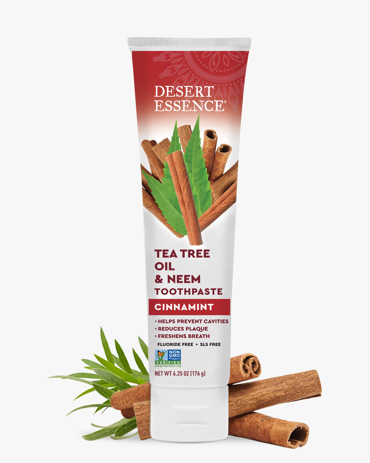 Desert Essence Tea Tree Oil & Neem Toothpaste Cinnamon flavor on a white background with cinnamon sticks and leaves.