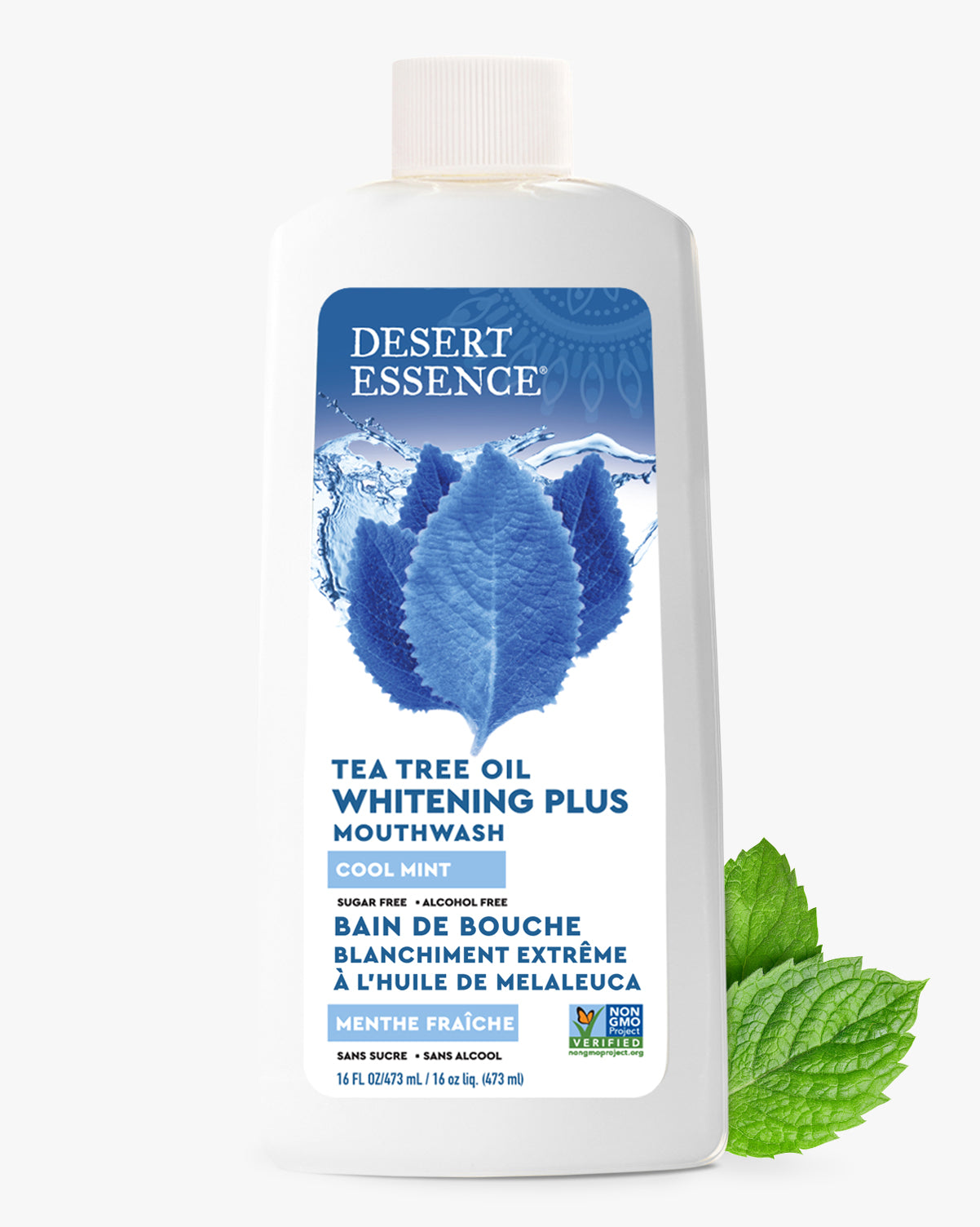 Desert Essence Tea Tree Oil Whitening Plus Mouthwash bottle with blue label and mint leaves on a white background
