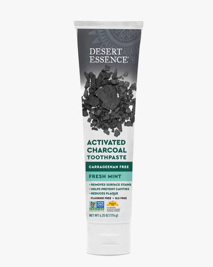 Desert Essence Activated Charcoal Toothpaste tube on a white background