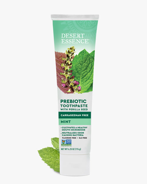 Desert Essence prebiotic toothpaste tube on a white background
