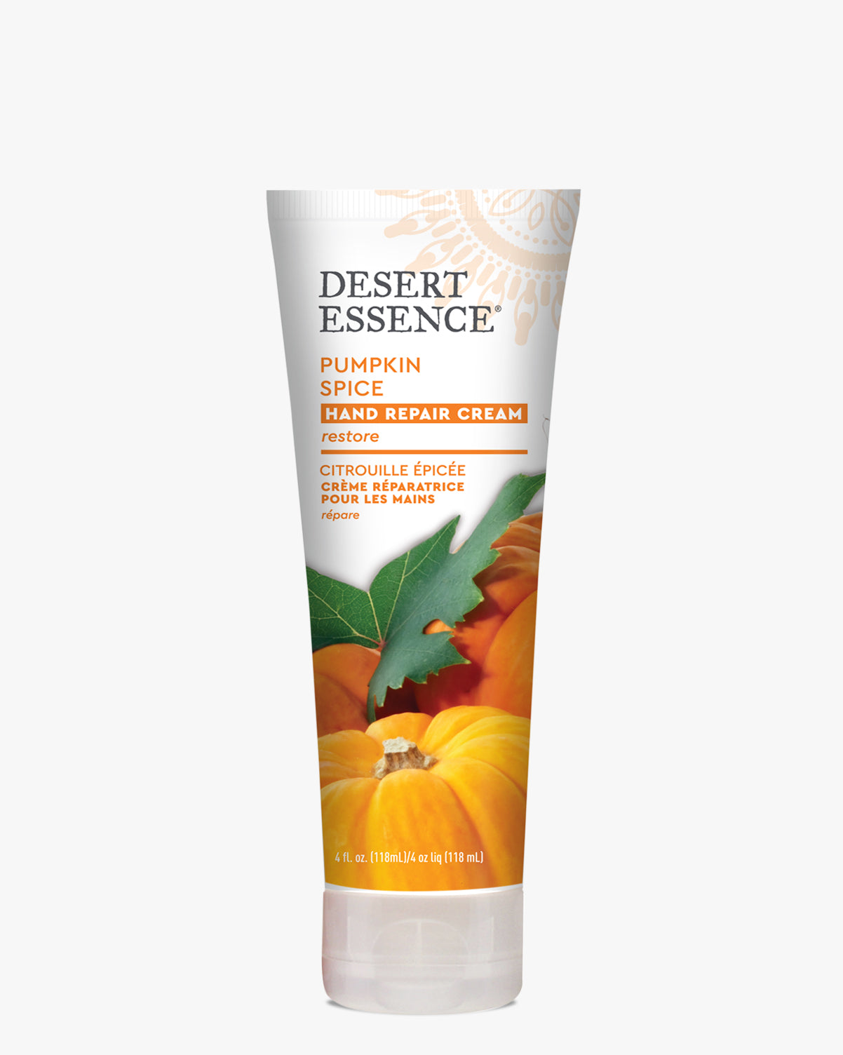 Desert Essence Pumpkin Spice Hand Repair Cream in a white tube featuring vibrant orange pumpkins and green leaves on the packaging. The organic hand cream is displayed against a clean white background, showcasing its natural ingredients and restorative properties.