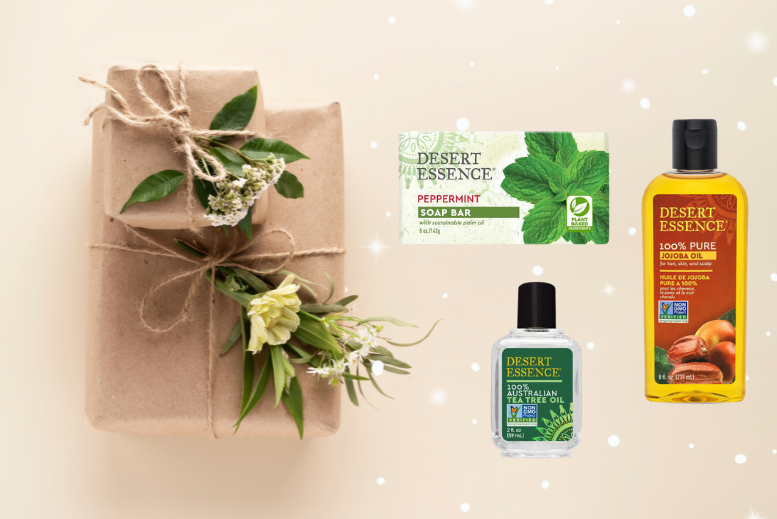 Eco-friendly gift-wrapped package with Desert Essence peppermint soap, tea tree oil, and jojoba oil.