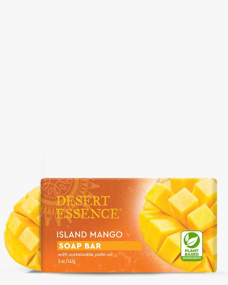 5 oz. of Desert Essence Island Mango Soap Bar with mangos next to it.