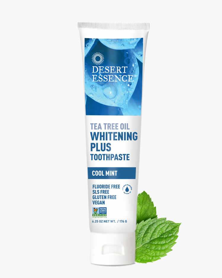 6.25 oz. tube of the Tea Tree Oil Whitening Plus Toothpaste Cool Mint with mint leaves by Desert Essence.