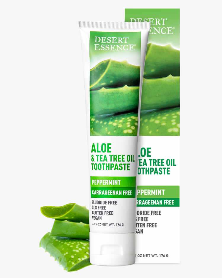 6.25 oz. tube of the Aloe and Tea Tree Oil Toothpaste Peppermint with peppermint leaves and packaging by Desert Essence.