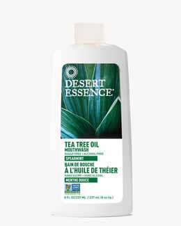 8 Fl. oz. bottle of the Tea Tree Oil Mouthwash Spearmint by Desert Essence.