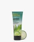Cucumber & Aloe Facial Lotion with Tea Tree Oil In Front of a Cucumber Slice
