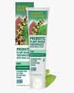 6.25 oz. tube of the Prebiotic Plant-Based Toothpaste Mint next to mint leaves and packaging by Desert Essence.